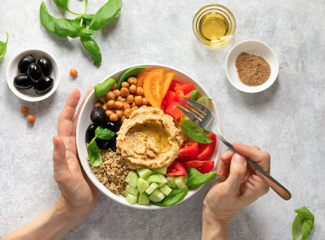 A bowl of fruits, vegetables and healthy fats.