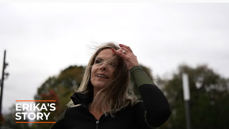 Erika brushes the hair out of her eyes as she prepares for a run