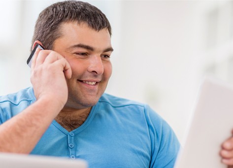 overweight man reading about surgical procedure