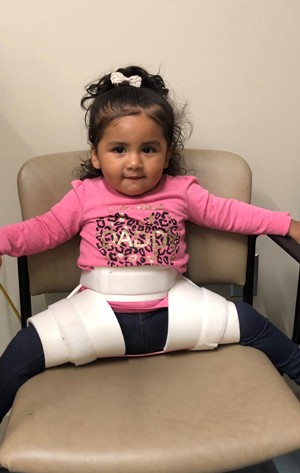 patient with abduction brace