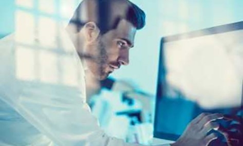 Doctor examines data on a computer screen. research and clinical trials