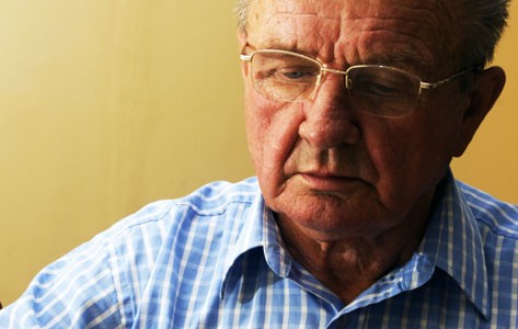 Elder man reading book
